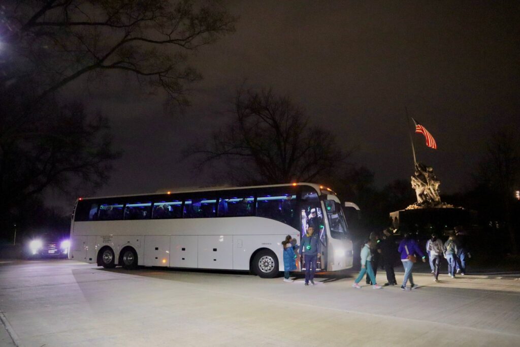 white bus coach at night